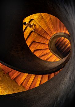 Capture of a person walking on a striking spiral staircase in Hong Kong.