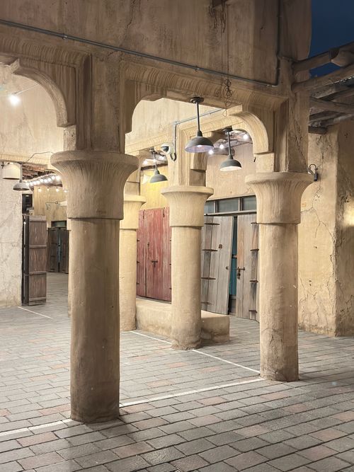 Free Intricate stone arches in Al Fahidi District, Dubai, showcasing traditional architecture at night. Stock Photo