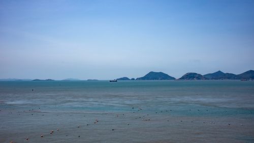 Free Tranquil seascape of Wenzhou's coast with distant islands under a clear blue sky. Stock Photo