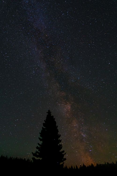 Free Majestic view of the Milky Way galaxy in a starry night sky above Schliersee, Germany. Stock Photo