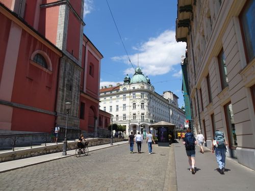 Free A vibrant summer day in Ljubljana showcasing historic architecture and street life. Stock Photo