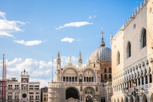 Free Scenic view of St. Mark's Basilica and Doge's Palace under a blue sky in Venice, Italy. Stock Photo