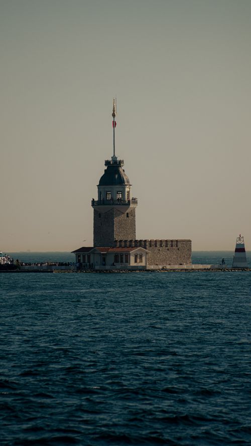 Free Historic Maiden's Tower standing in the Bosphorus Strait during dusk, Istanbul's iconic landmark. Stock Photo