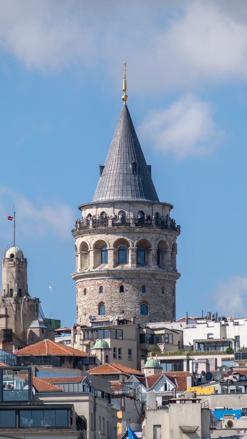 Free Stunning view of the iconic Galata Tower rising above the rooftops of Istanbul under a clear blue sky. Stock Photo