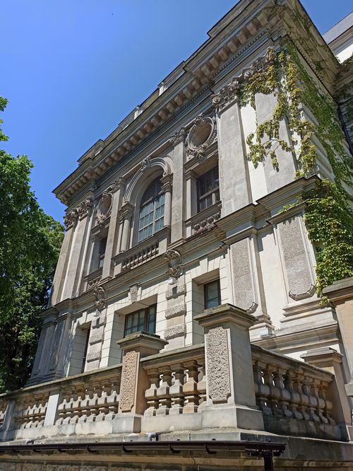 Free Ornate historic building facade with ivy on a sunny day. Stock Photo