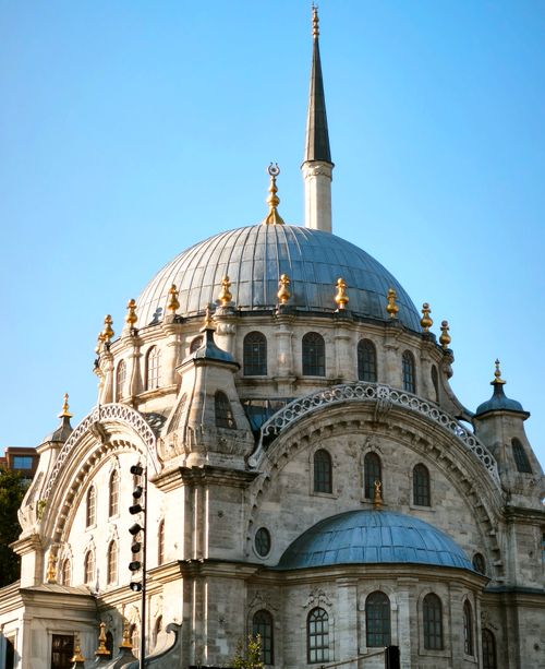 Free Stunning view of an Ottoman-era mosque against a clear blue sky, showcasing intricate architectural details. Stock Photo