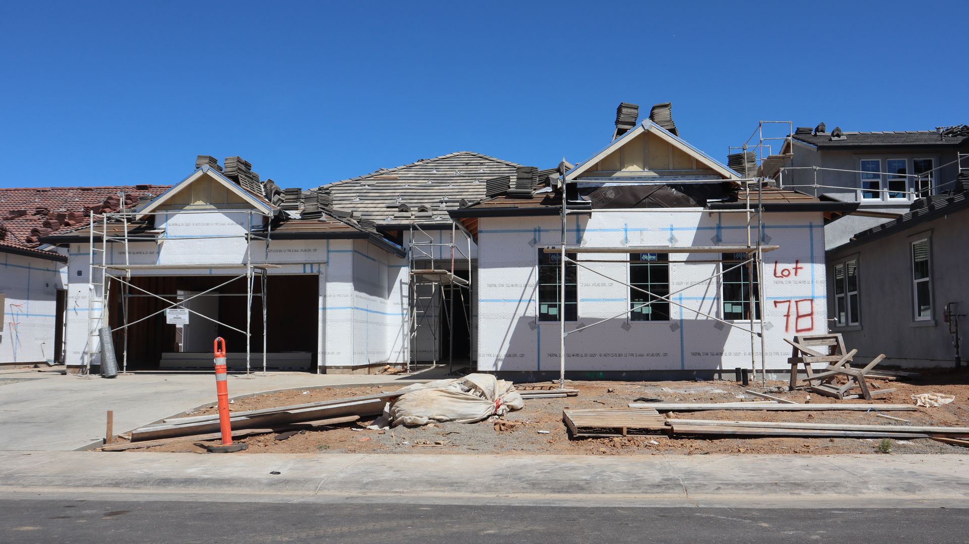 Single-family home under construction with scaffolding