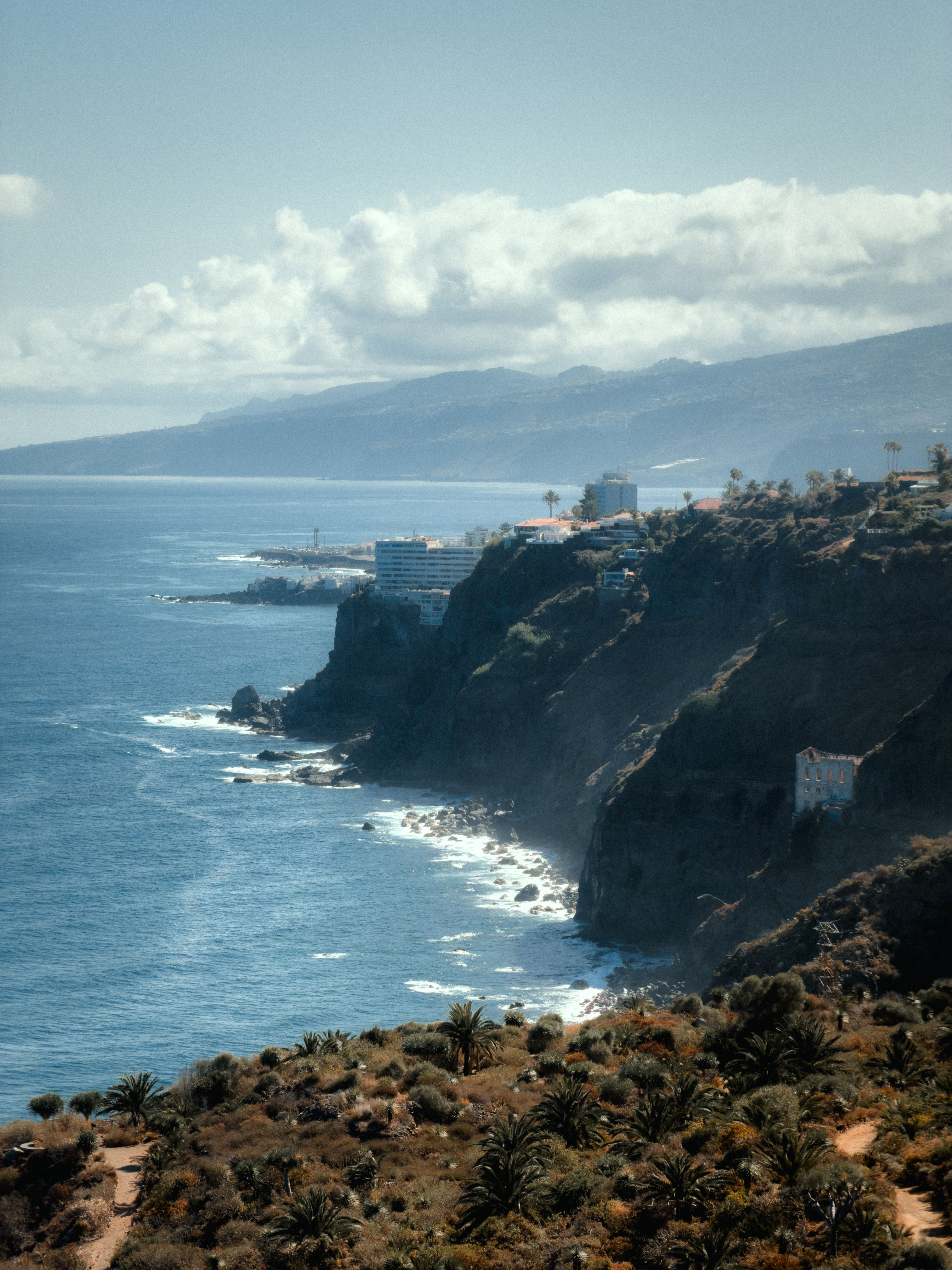 Dramatic cliffs overlooking the serene Atlantic Ocean on Tenerife, Canary Islands.