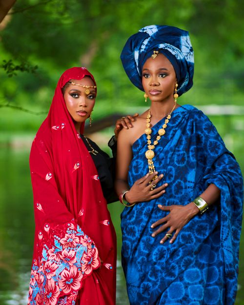 Free Two women in vibrant traditional attire pose outdoors in Kano, Nigeria, showcasing cultural heritage. Stock Photo