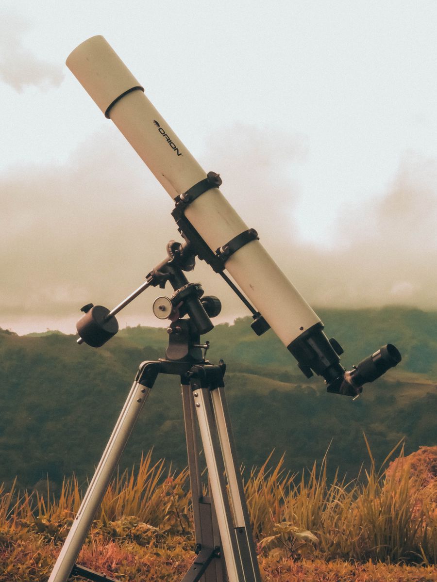 Telescope on tripod at dusk