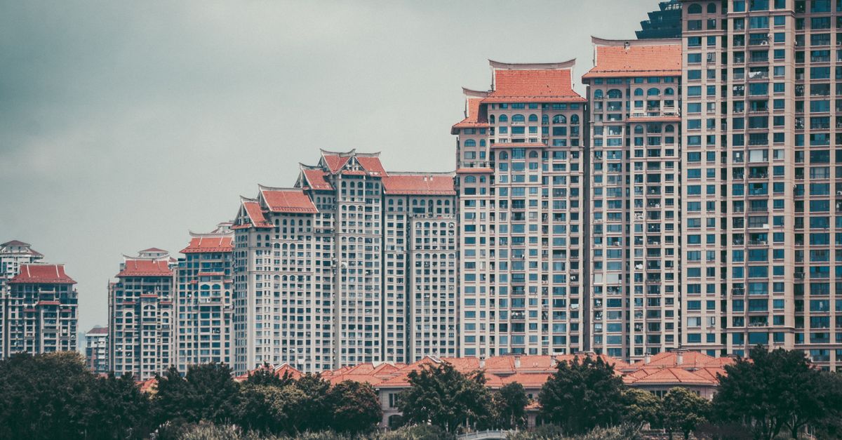Skyline of modern residential buildings with traditional roofs in Xia Men Shi, China.