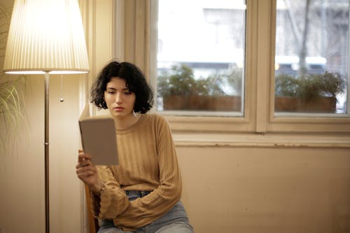 Free Woman Reading a Book Stock Photo