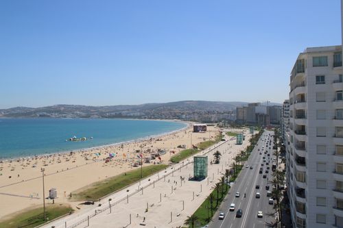Free Stunning aerial view of Tangier's sandy beach and bustling city in Morocco. Stock Photo