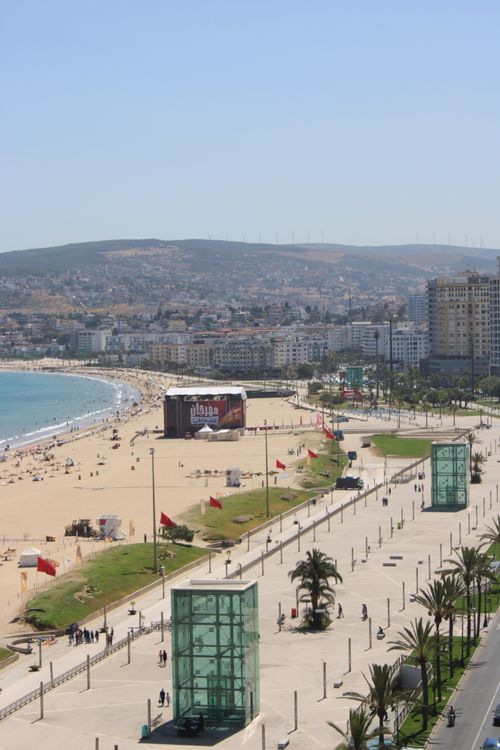 Free Aerial view of Tangier beach and promenade on a sunny day, crowded with people. Stock Photo
