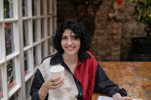 Woman Holding Disposable Cup