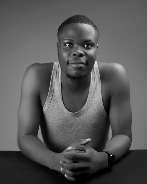 Free A black and white portrait showcasing a confident young man in casual attire. Stock Photo