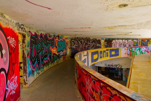 Explore colorful graffiti art inside an abandoned building located in Makarska, Croatia.