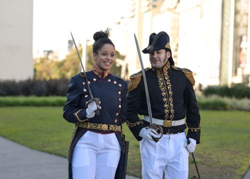 Free Portrait of two people in historic military costumes in a Buenos Aires park. Stock Photo