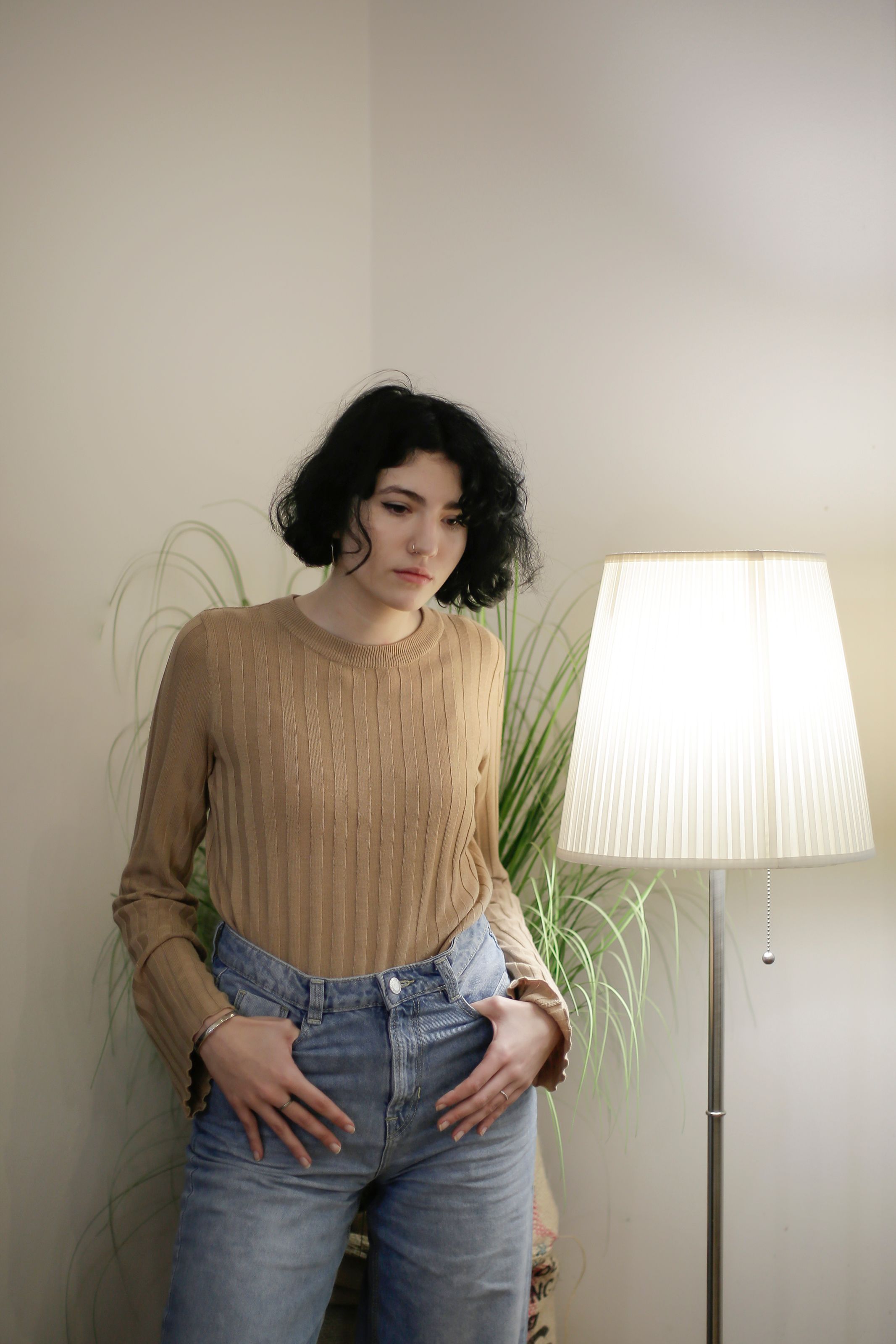 Woman in Brown Top and Blue Denim Jeans · Free Stock Photo