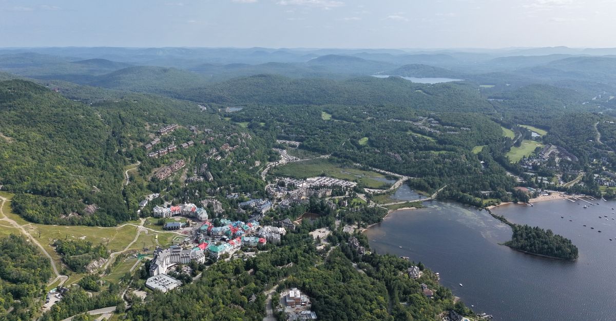 Stunning aerial view of Mont-Tremblant with colorful buildings and natural landscape.