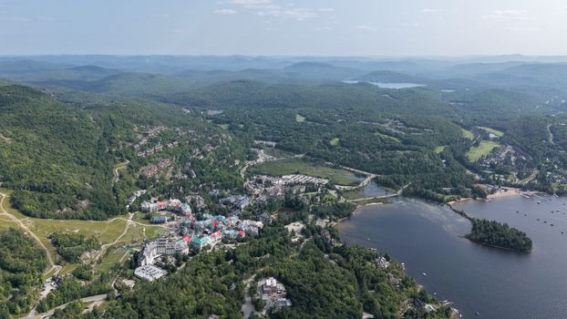 Stunning aerial view of Mont-Tremblant with colorful buildings and natural landscape.