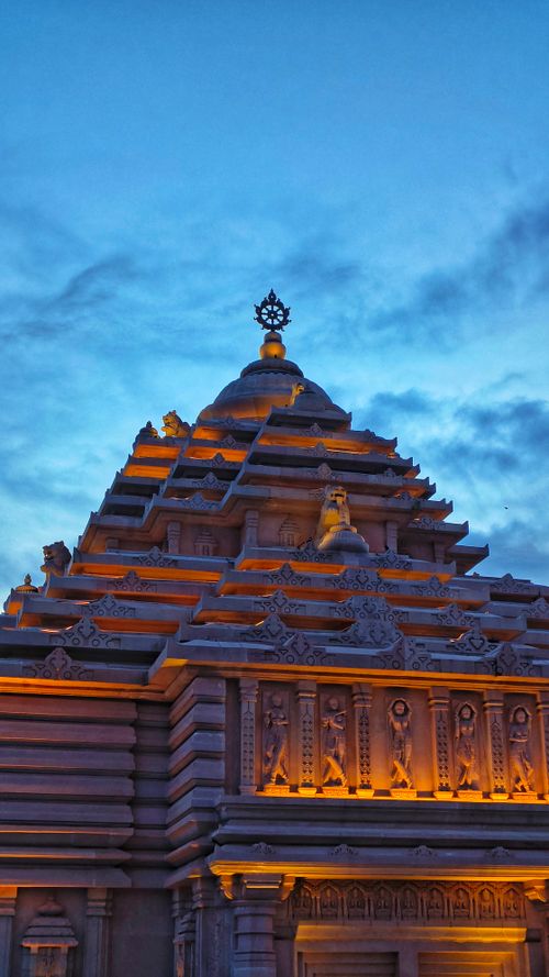 Free Beautifully lit Hindu temple in Digha, India against a dramatic evening sky. Stock Photo
