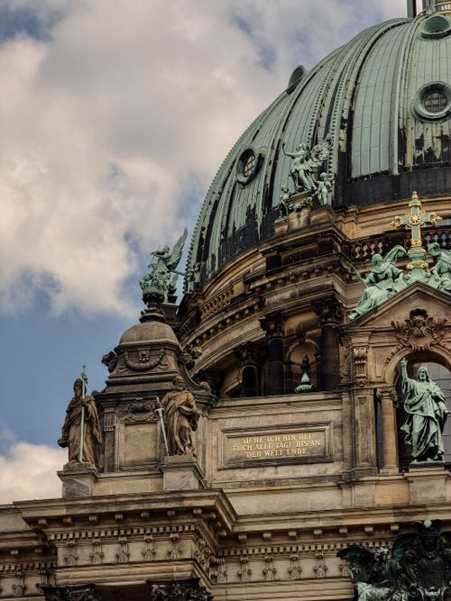 Free Detailed view of Berlin Cathedral's ornate architecture under a blue sky. Stock Photo