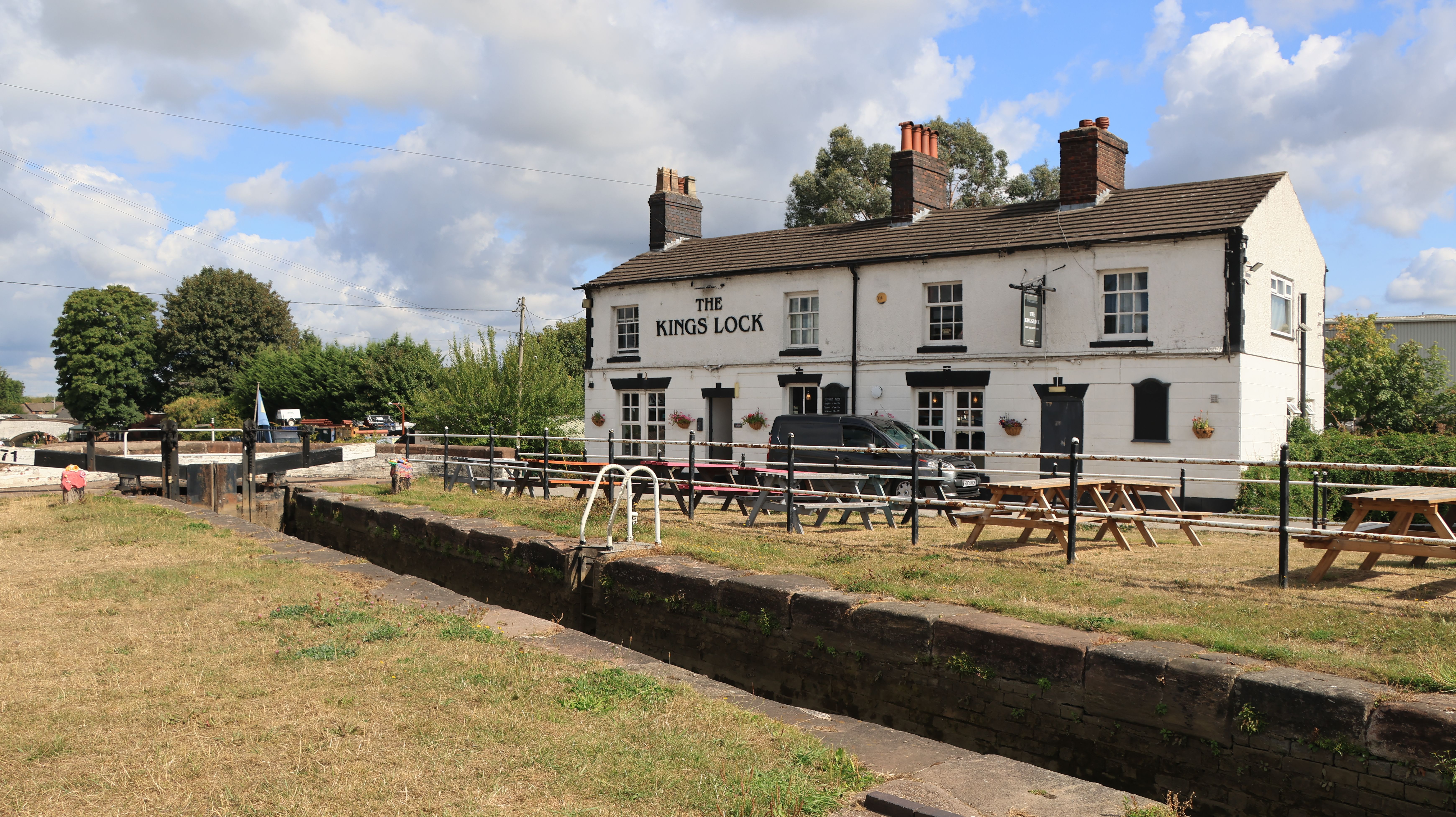 Charming Kings Lock pub along canal in Middlewich, Cheshire during a sunny day.