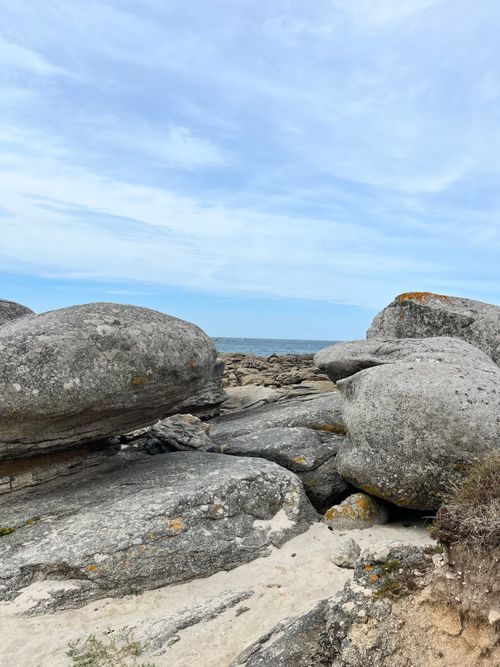Free Beautiful rock formations by the sea in Plouescat, Brittany, France under a blue sky. Stock Photo