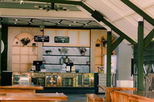 Warm and inviting outdoor cafe scene in Jawa Barat, Indonesia, showcasing modern decor.