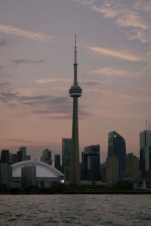 Free Twilight view of Toronto's skyline, dominated by the CN Tower during a serene evening. Stock Photo