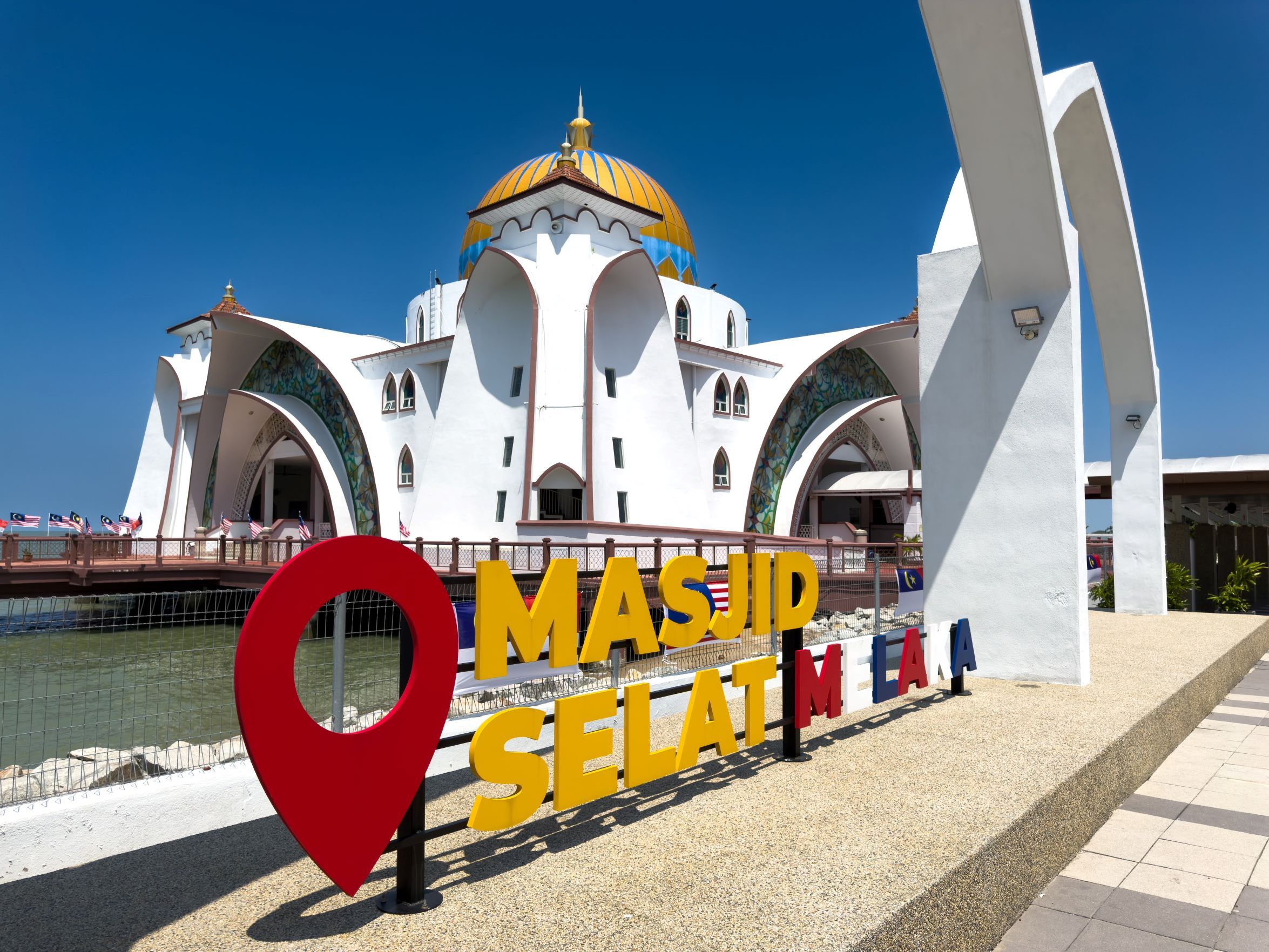 Explore the stunning architecture of Masjid Selat Melaka, a floating mosque on the Malacca Strait.