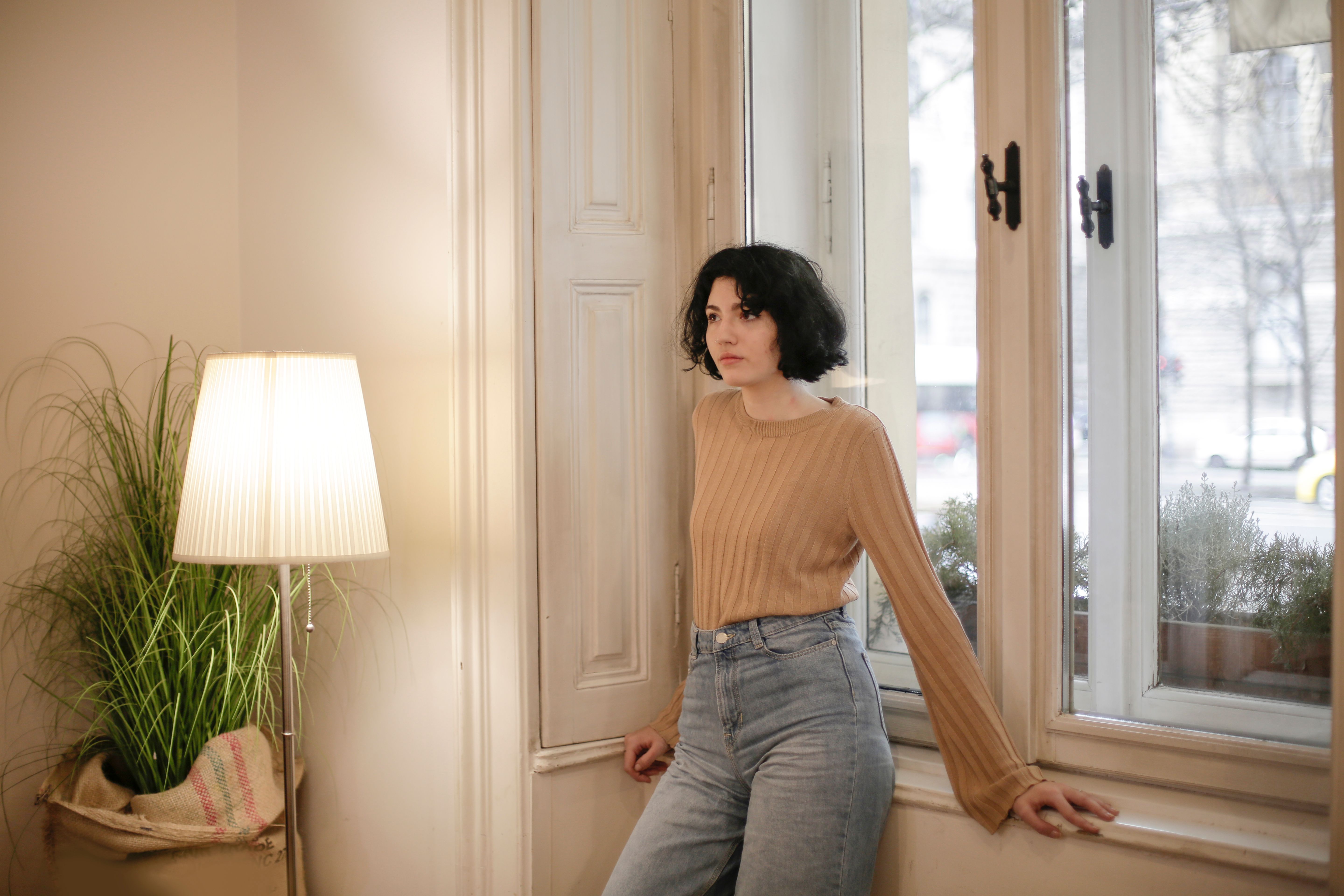 Woman in Brown Top and Blue Denim Jeans · Free Stock Photo