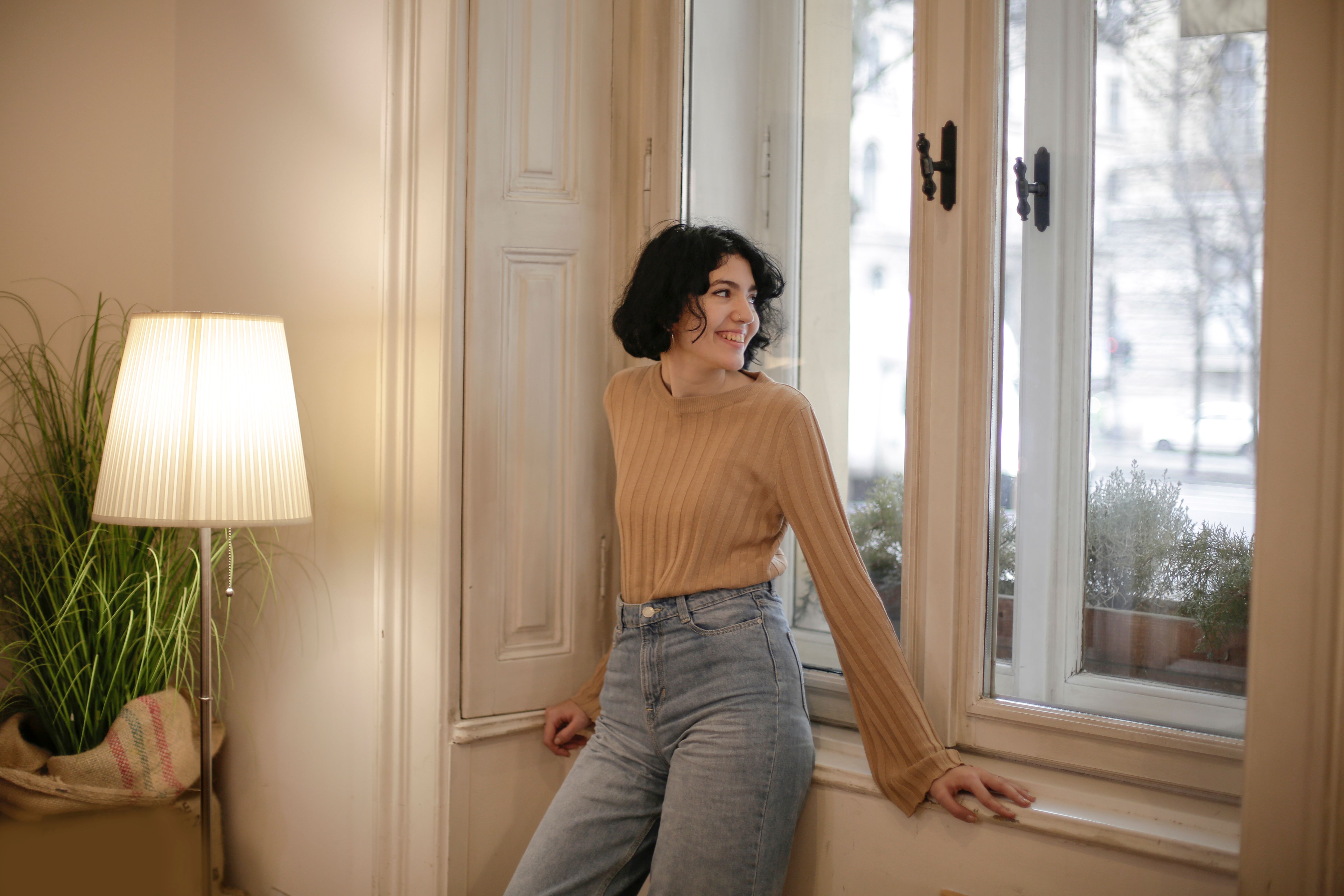 Woman in Brown Top and Blue Denim Jeans · Free Stock Photo
