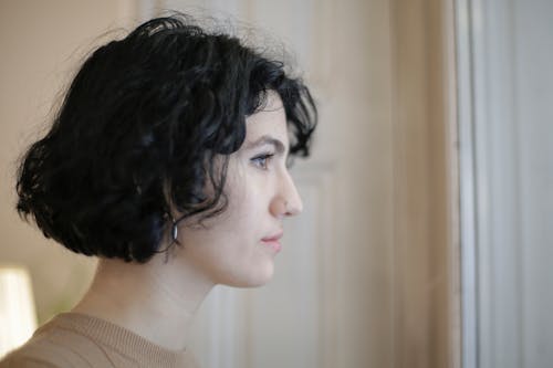 Woman in Beige Knit Shirt