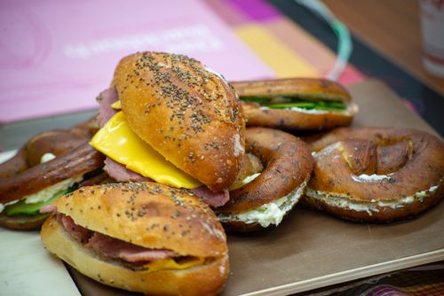 Free Close-up of assorted bagels with ham, cheese, and cream cheese. Stock Photo