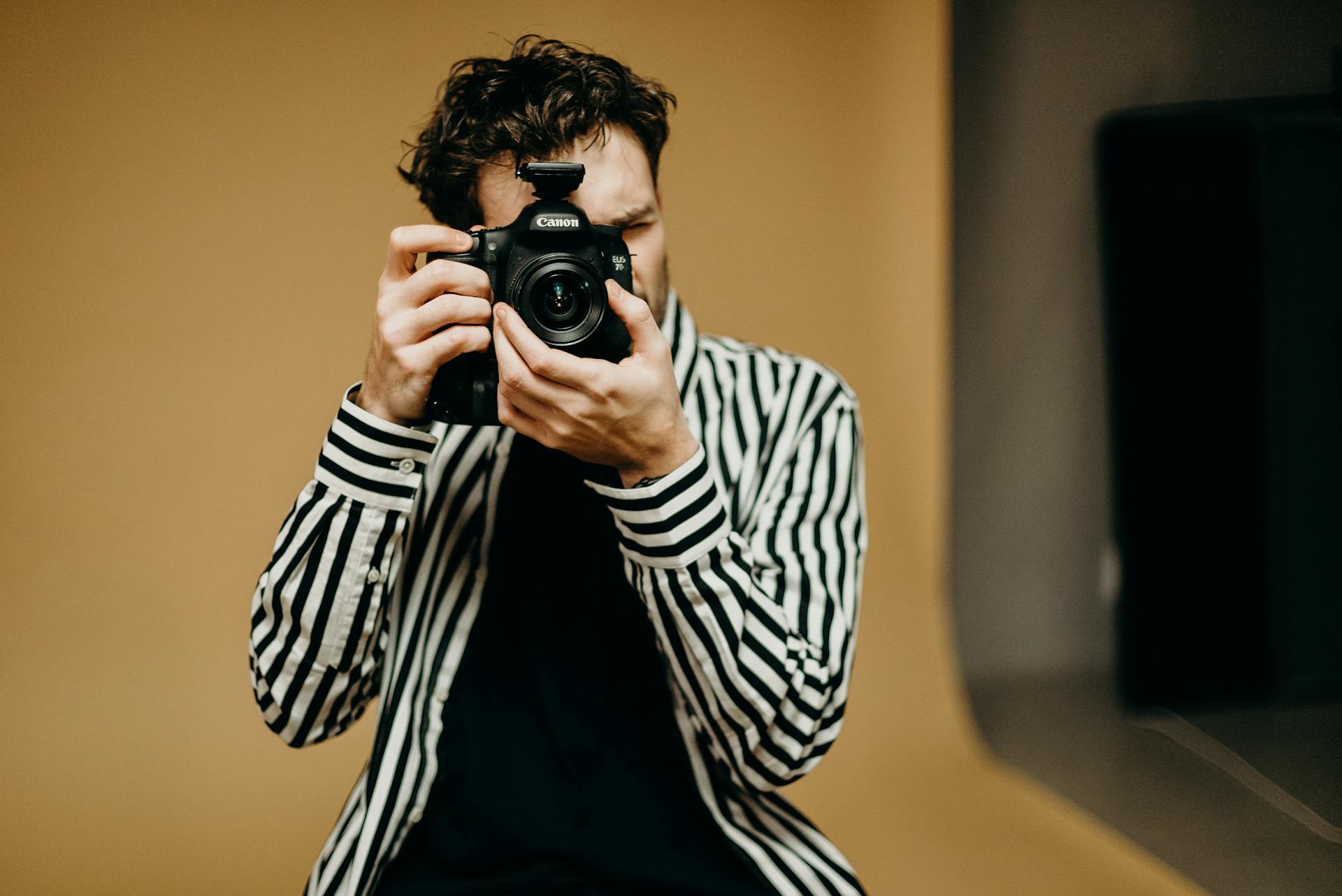 Photo Of Man Holding Black Camera