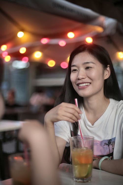 Photo Of Woman Holding Straw