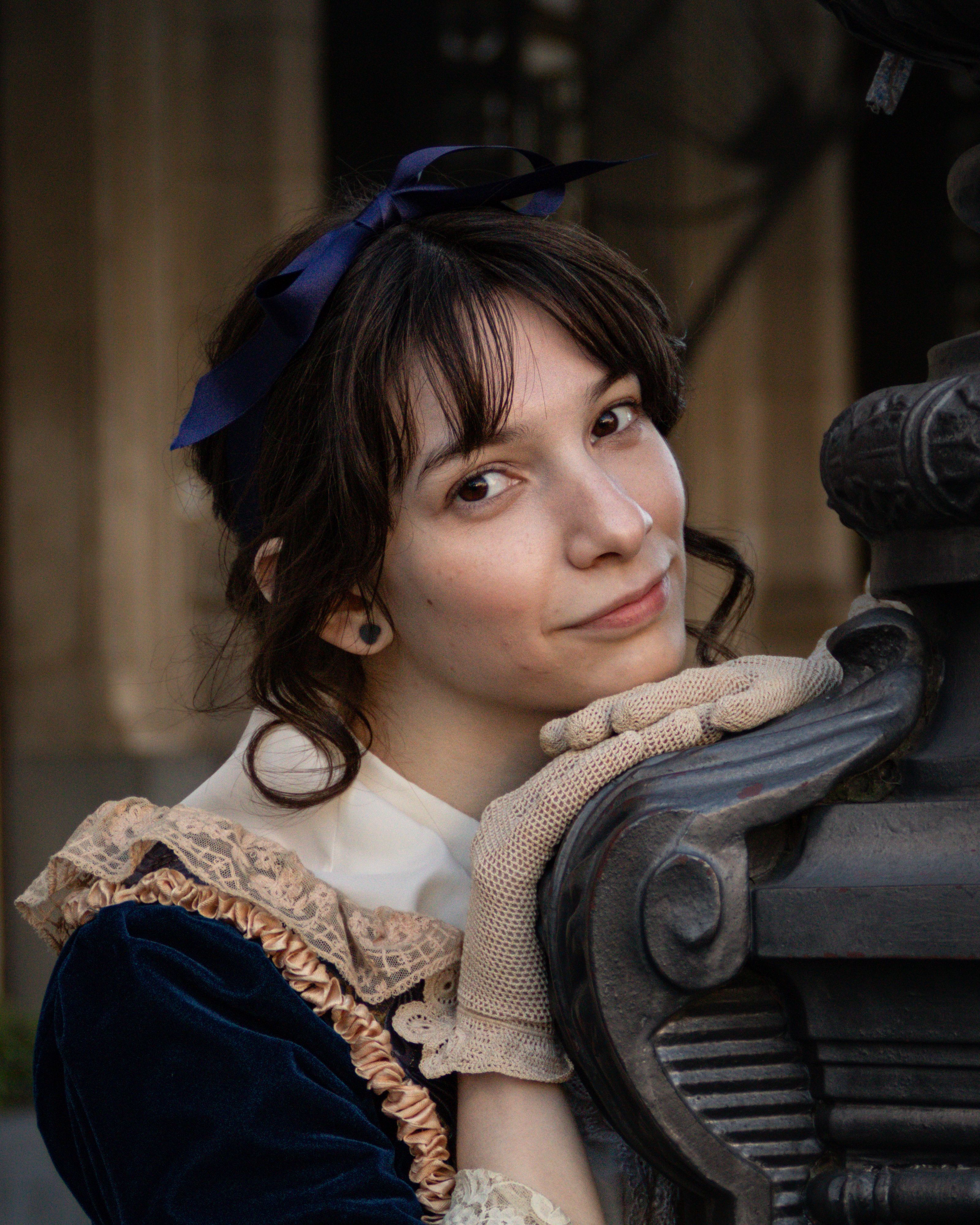 Portrait of a woman in vintage clothing posing outdoors in Buenos Aires, Argentina.
