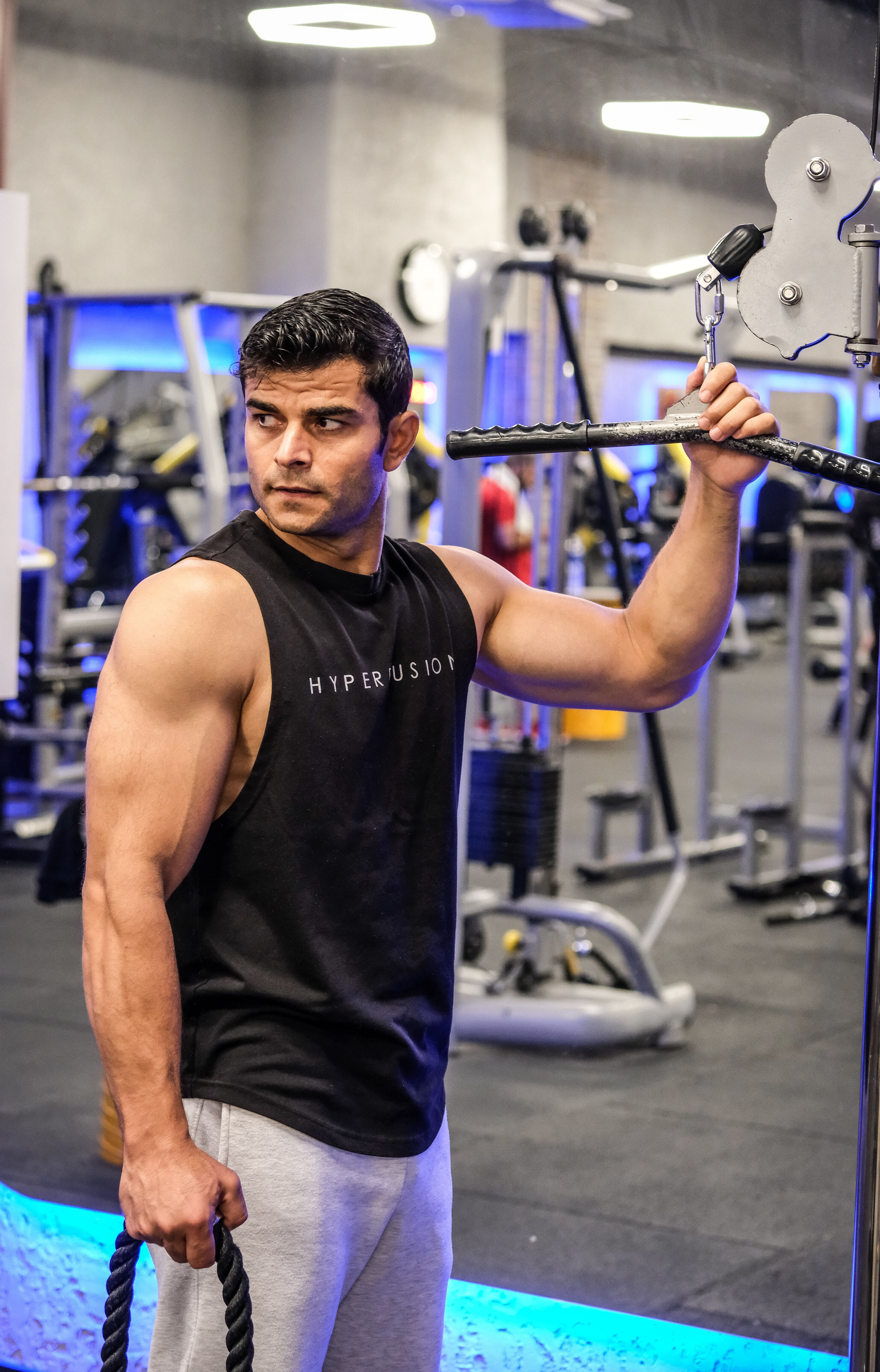 Athlete preparing weights inside a modern training room