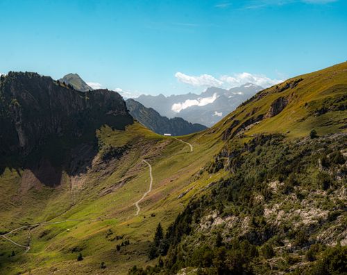Free Beautiful Swiss Alps scenery with a mountain path in Morschach, Schwyz, Switzerland, showcasing vibrant summer greenery. Stock Photo