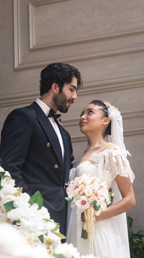 Free Charming wedding photo of a young couple in an elegant setting, capturing their love and style. Stock Photo