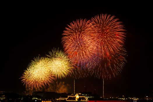 Stunning fireworks illuminating the night sky over Yokohama Harbor in Japan, showcasing vibrant colors and celebration.