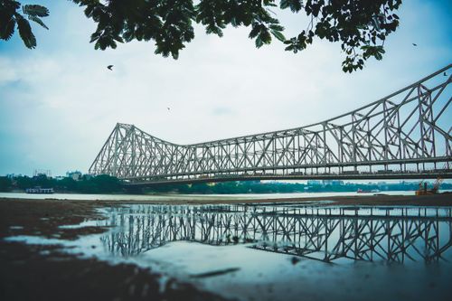Free Stunning view of Howrah Bridge with reflection. Frame the scenic beauty from Kolkata. Stock Photo