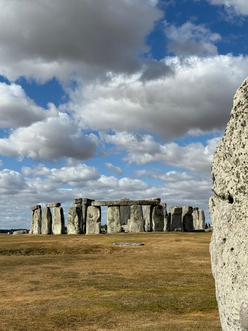 Free Capture of Stonehenge on a clear day with a dramatic sky, showcasing ancient stone structures. Stock Photo