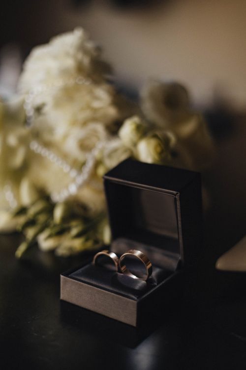 Free Close-up of gold wedding rings in a decorative box, perfect for wedding themes. Stock Photo