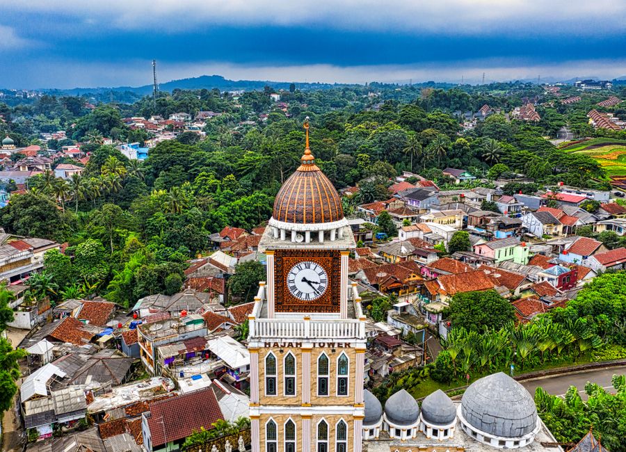 Stunning aerial shot showcasing a clock tower and surrounding urban landscape in Bogor, West Java, Indonesia.