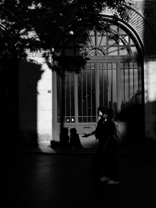Free Black and white silhouette of people walking in the shadows on an Istanbul street, with sunlight casting shadows. Stock Photo