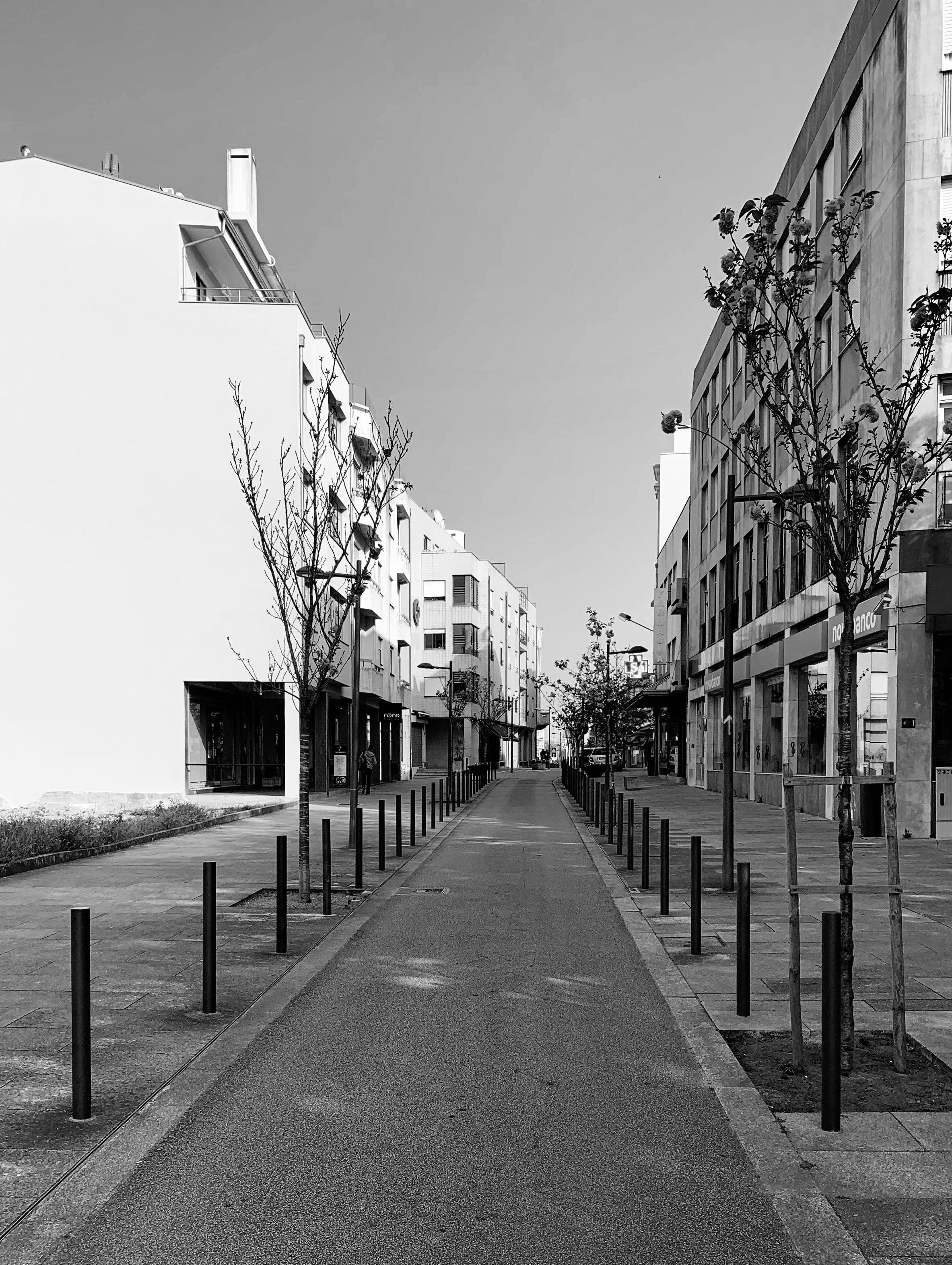 Black and white photo of an empty street in São João da Madeira, Portugal.