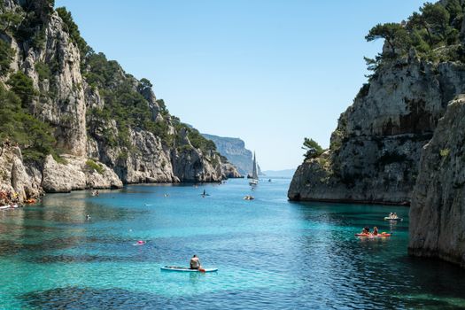 Explore the stunning calanques near Marseille, France, with clear blue waters and rugged cliffs.